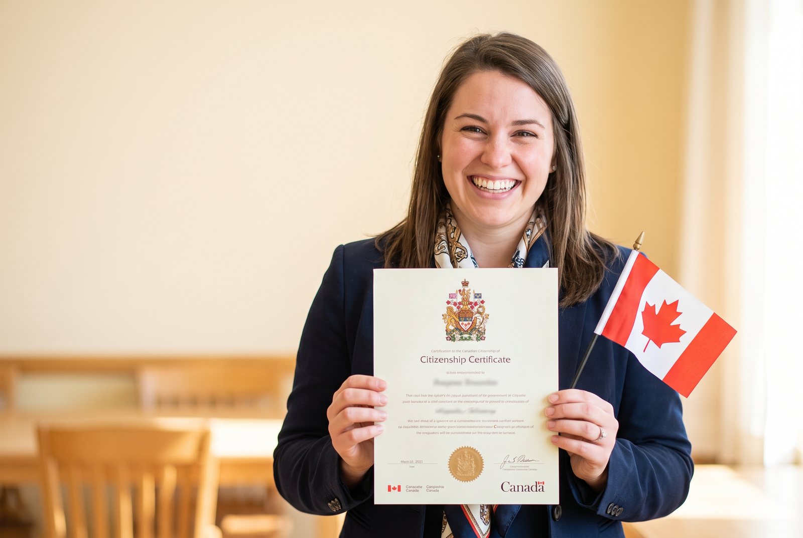 A proud new citizen holding a citizenship certificate